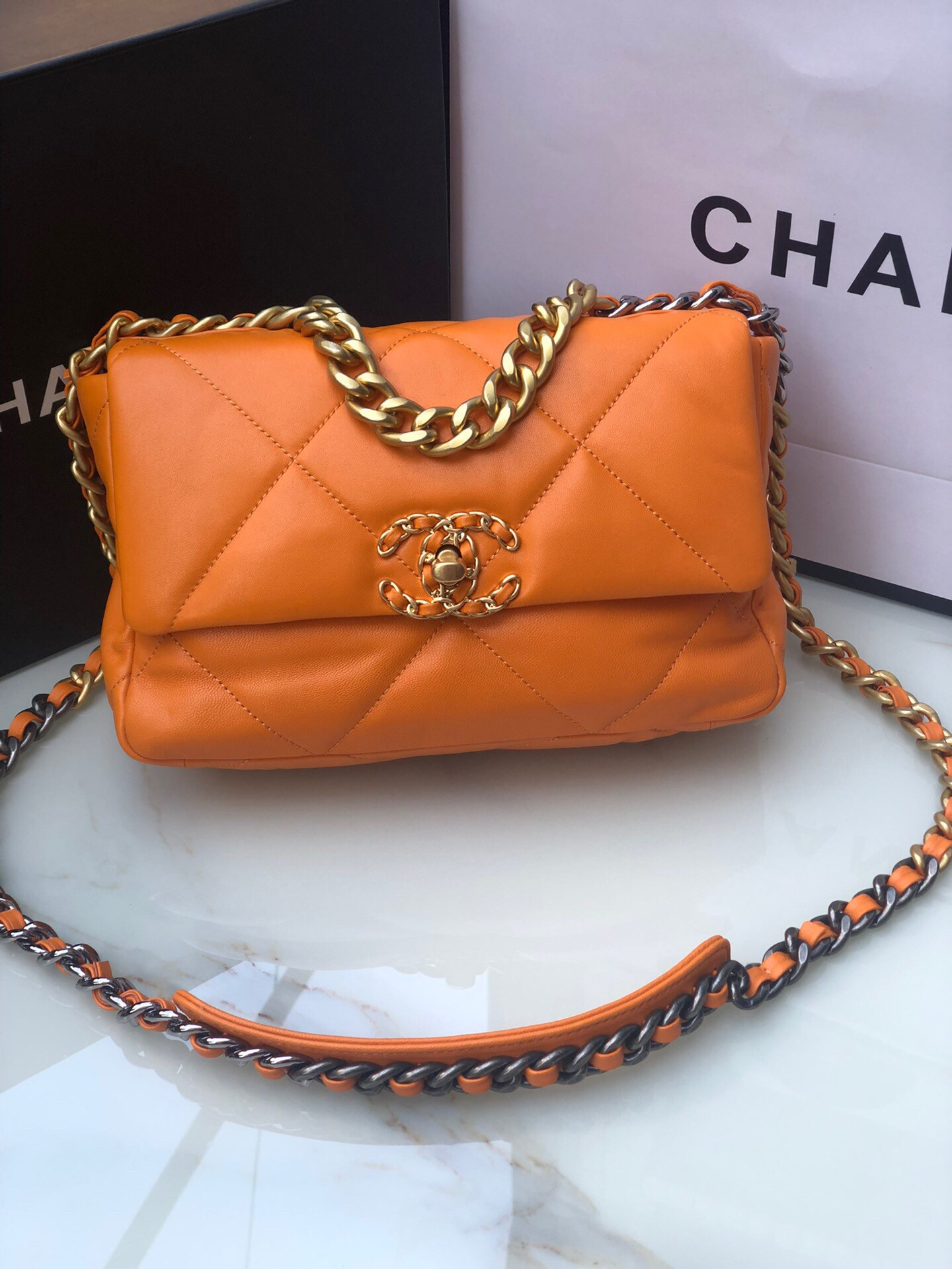 Ch*el 19 handbag shiny leather, gold-tone, silver-tone & ruthenium-finish metal orange 6.2 × 10.1 × 3.5 in