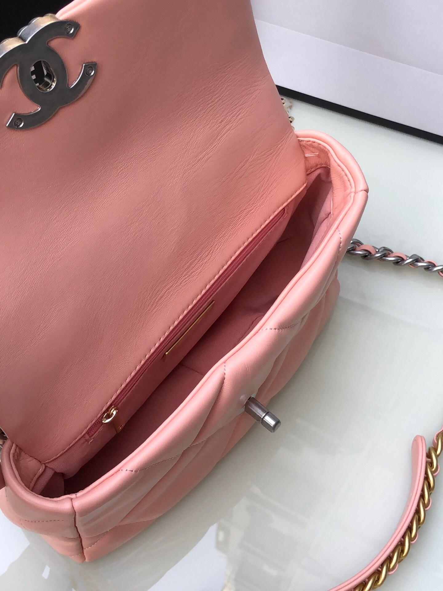 Ch*el 19 handbag shiny leather, gold-tone, silver-tone & ruthenium-finish metal light pink 6.2 × 10.1 × 3.5 in