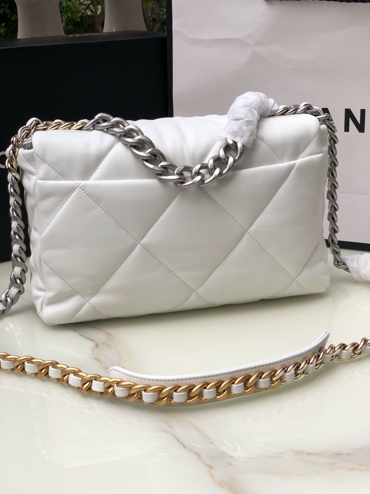 Ch*el 19 large handbag shiny leather, gold-tone, silver-tone & ruthenium-finish metal white 7.8 × 11.7 × 3.9 in